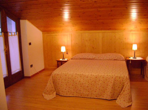 One of our rooms: we have three double rooms, to which we can add an additional bed.